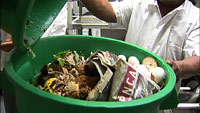 Commercial garbage canister full of food waste