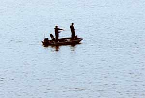 Fishermen fishing in boat