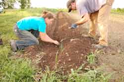 Amber Baker and Jason Karnezis planting starters.