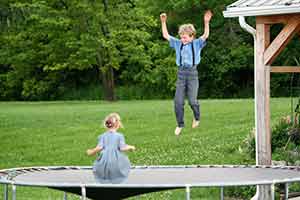 Daniel Kline's Children Jumping on Their Trampoline